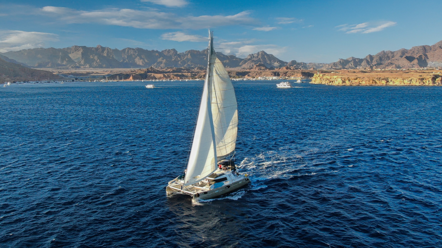 Sailing yacht on the Red Sea with the Sinai mountains behind Sharm El Sheikh